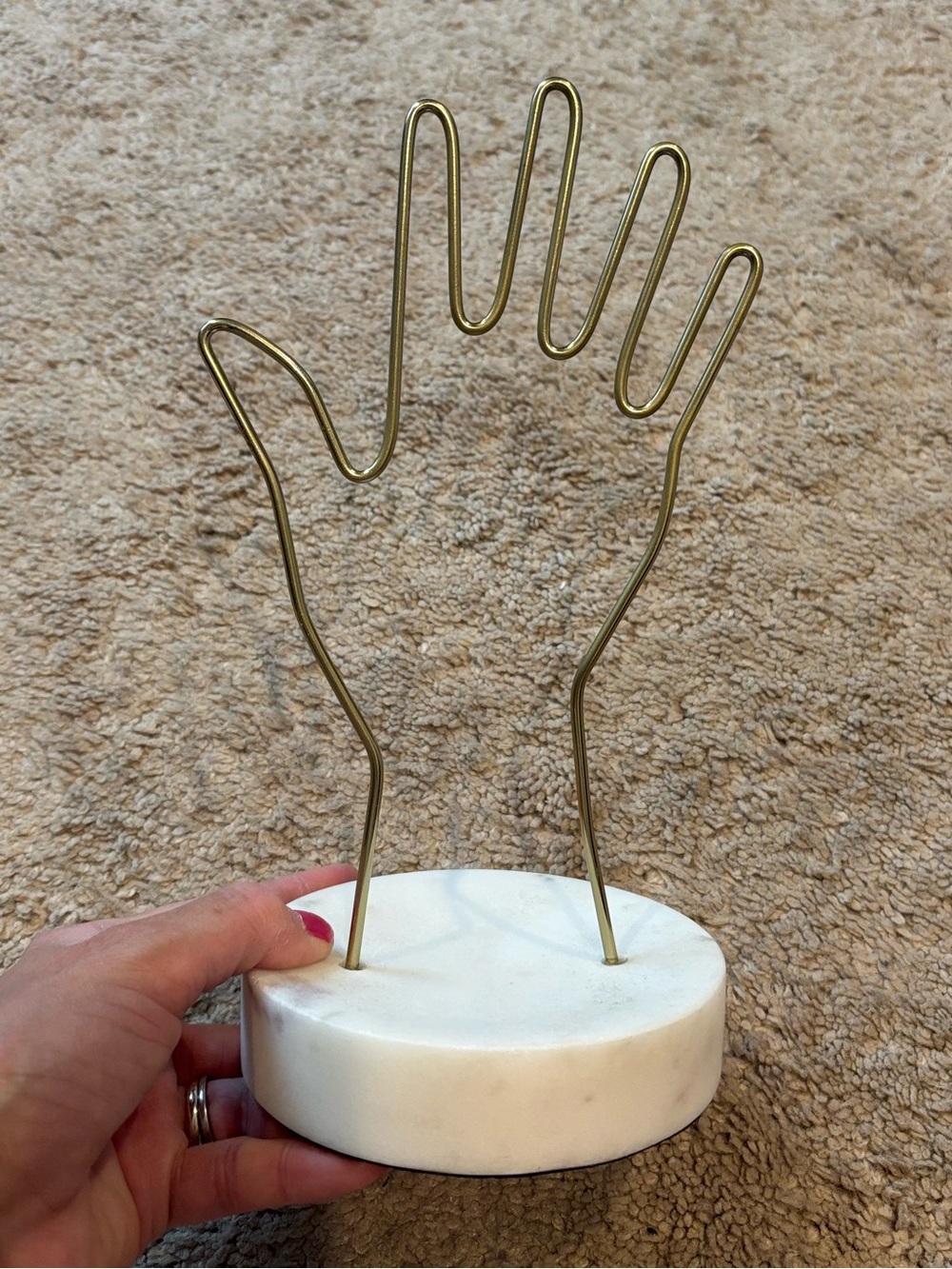 Gold Wire Hand Jewelry Holder on White Marble Base